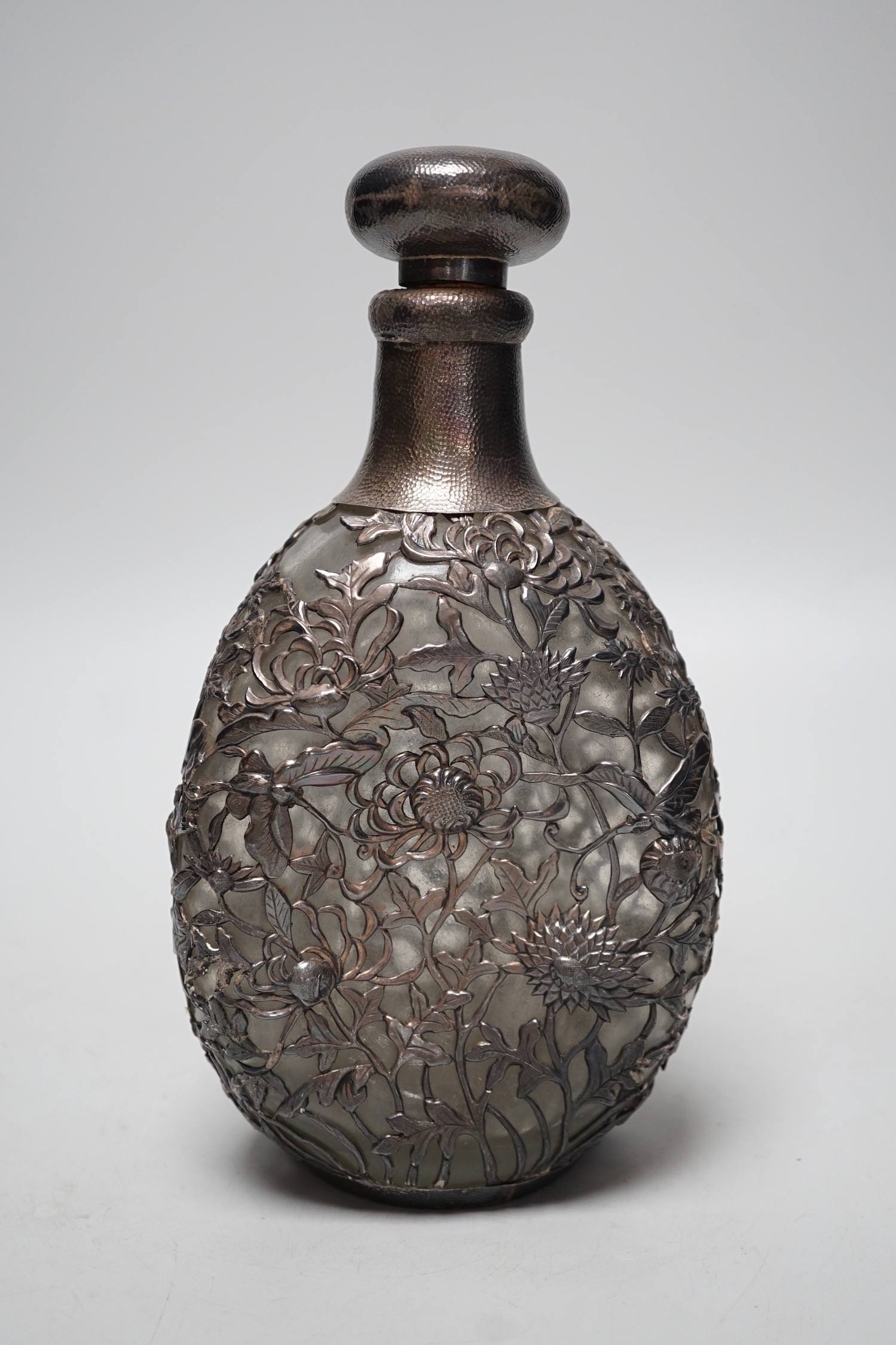 A Chinese planished white metal mounted dimpled decanter and stopper, by Yeching, 23.5cm.